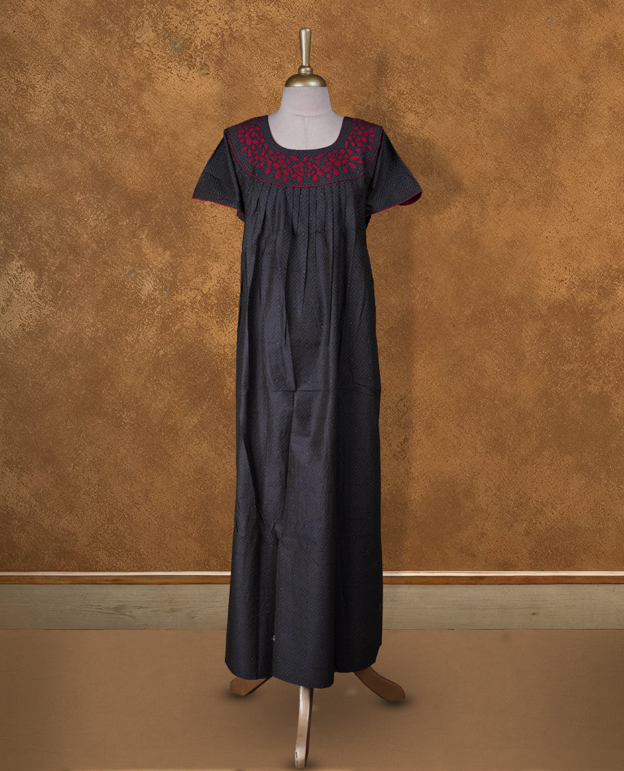 Black colour NStyle nighty featuring white geometric pattern, red colour floral patterns on a U neckline with red colour pipe details , short sleeves, and a full ankle-length design.