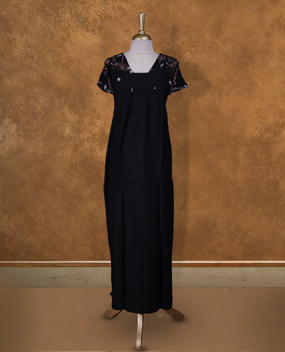 Black Colour NStyle nighty featuring purple and white floral patterns, a square neckline with button detailing, short sleeves, and a full ankle-length design.