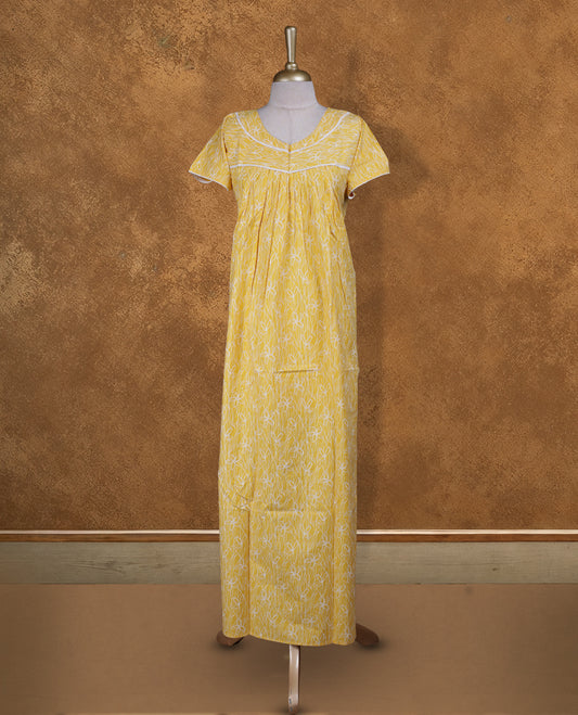 bright Yellow colour NStyle nighty featuring White patterns, a V-neckline with lace detailing, short sleeves, and a full ankle-length design.