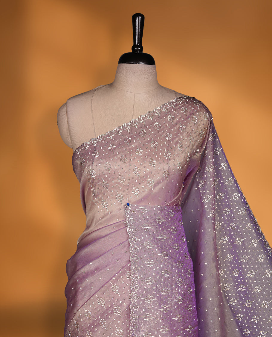 Lavender Colour Shimmer Designer Saree featuring Delicate White Stone Scattered Work on the Body, enhanced with Intricate Stone Detailing on the Border and Pallu, paired with a Matching Blouse.