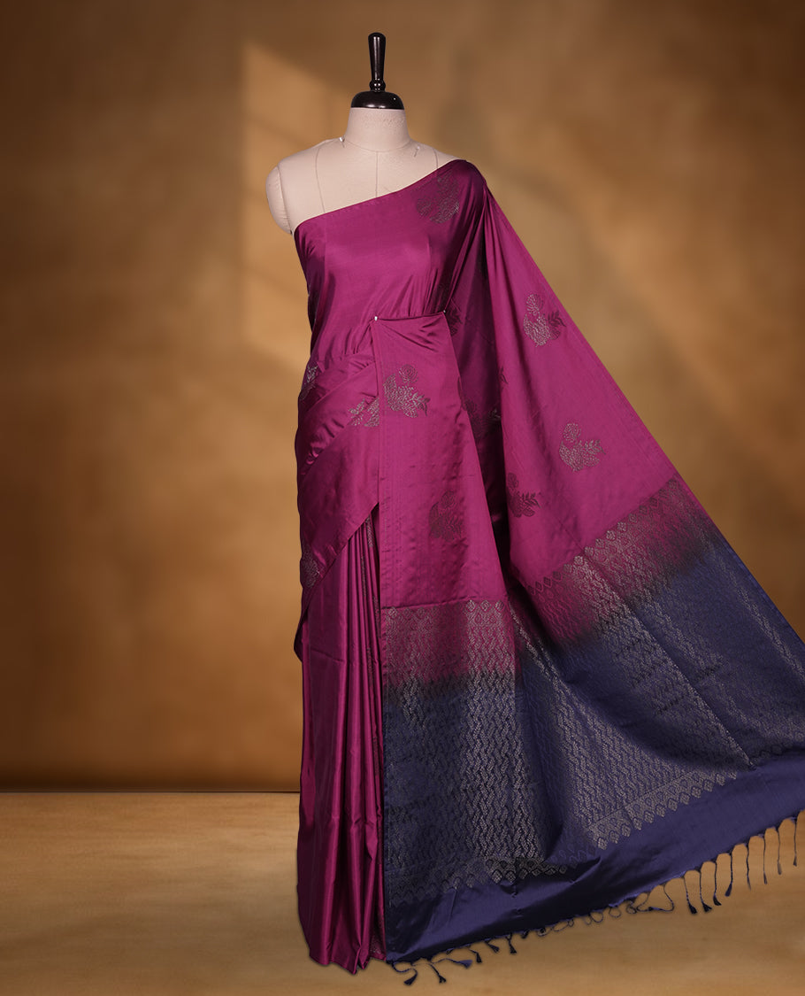 Boysenberry colour soft silk saree featuring Antique zari motifs on body with Highlighting contrast Navy blue colour pallu and paired with matching blouse piece.