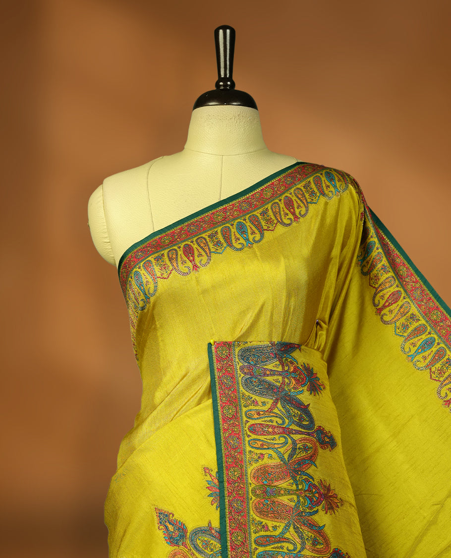 Lemon green colour Pashmina silk saree densely woven with intricate multicolour floral and architectural motifs across the body, framed by an opulent arabesque border and grand storytelling pallu, paired with a matching black woven border blouse piece