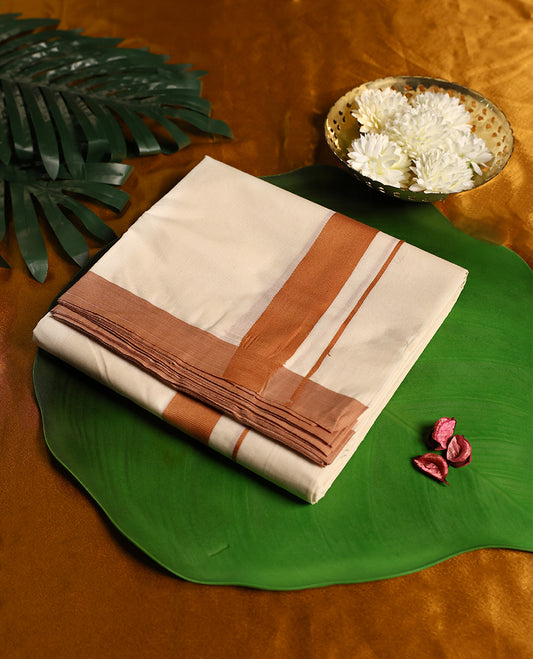 Traditional off white colour pure cotton dhoti featuring a classic copper zari border, blending tradition with understated elegance, making it an ideal choice for weddings, festive occasions, and temple rituals.