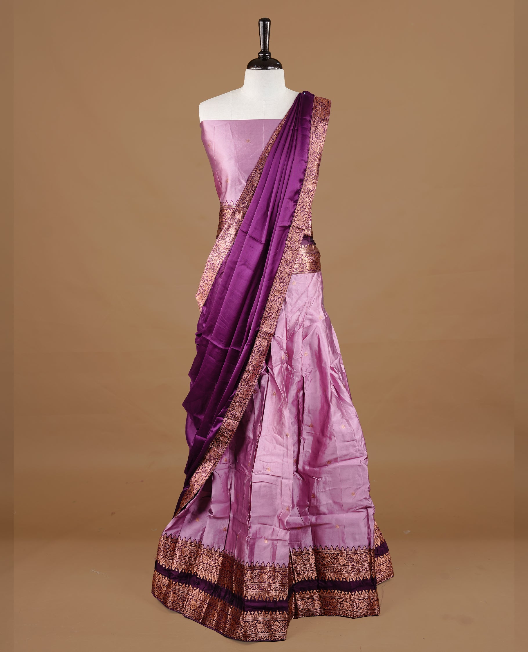 Pink colour semi stitched Half saree featuring contrast Deep purple colour with gold zari traditional border skirt, paired with matching zari border dupatta, unstitched blouse piece