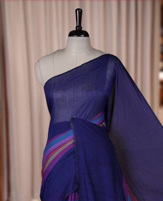 Navy blue colour soft cotton saree with rainbow colored horizontal lines on the body, a vibrant multicolor pallu, and a subtle border & Elegant and lightweight, this saree comes without a blouse piece for a customizable style.