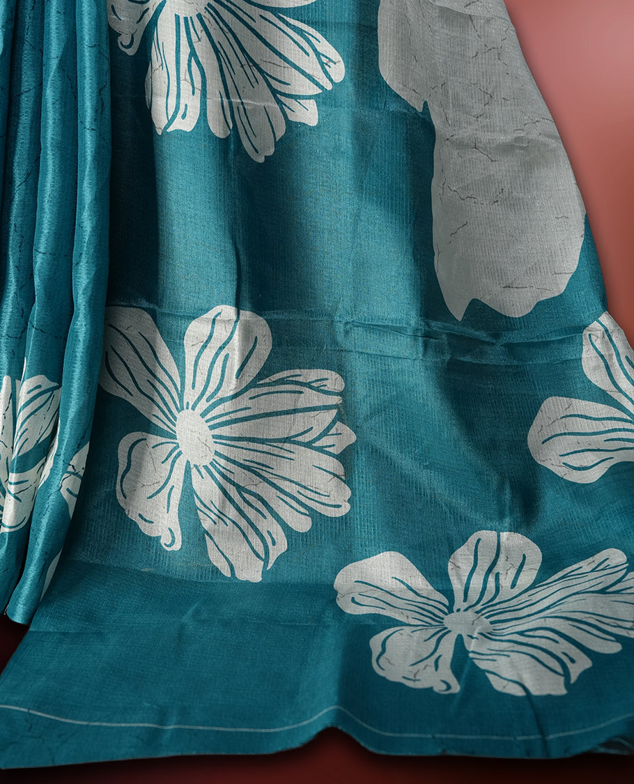 Sky blue colour saree with off white floral motifs and subtle , exuding timeless elegance and modern charm & paired with a matching blouse.