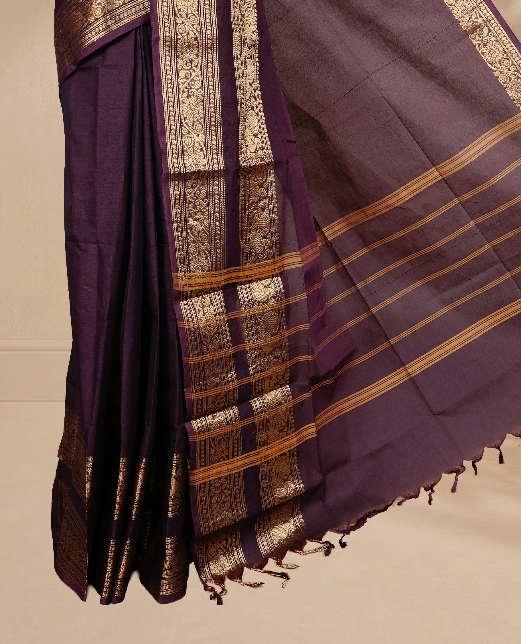 Chocolate brown colour Chettinad cotton saree featuring Elegant plain body, complemented by self colour with Gold zari border, paired with matching blouse piece.