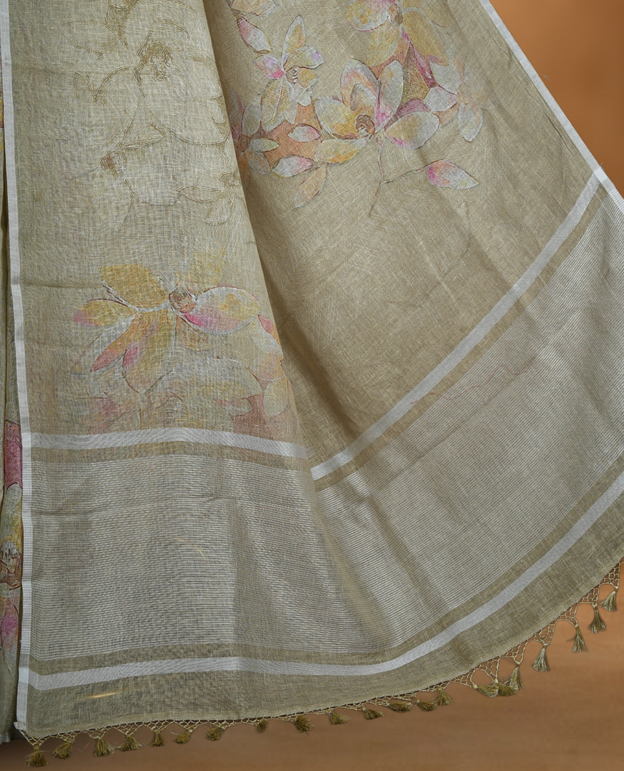Khaki colour pure linen saree featuring Floral print pattern across body, silver thin border finished with matching blouse.