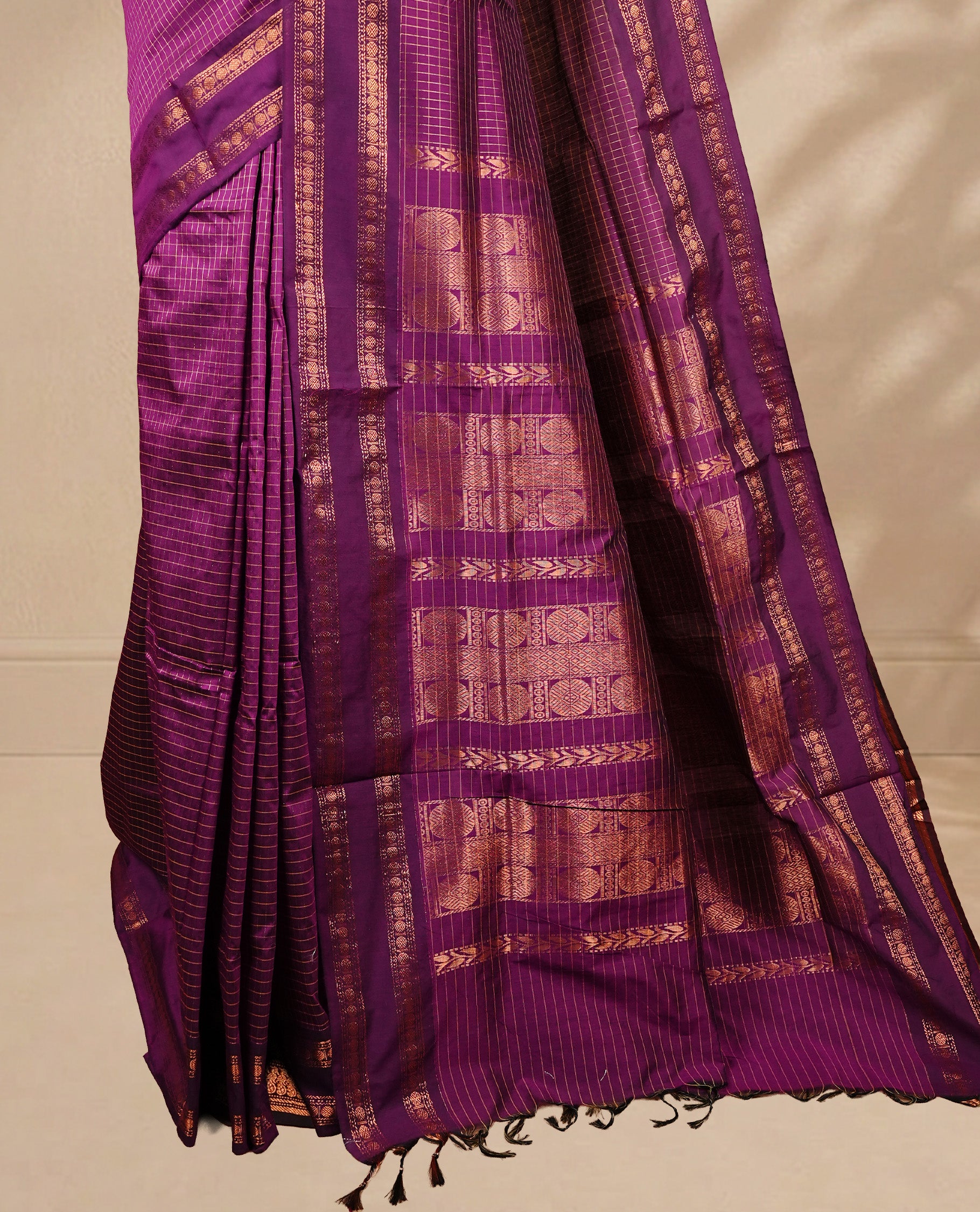 Grape colour kalyani cotton saree featuring gold zari Check pattern on body, complemented by self colour with Antique zari border, paired with matching blouse piece.