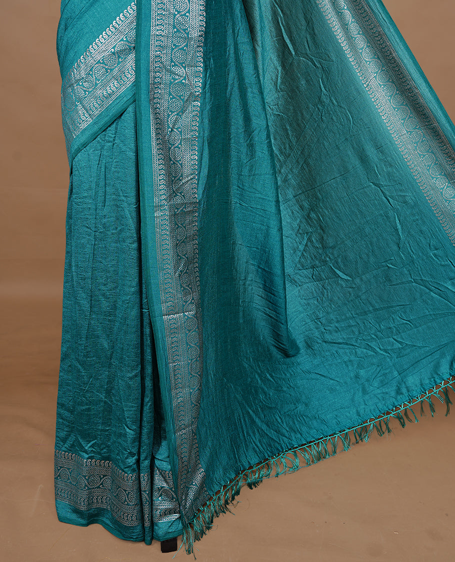 Aqua colour semi silk saree featuring Elegant plain body with fancy border, comes with matching self colour blouse piece.