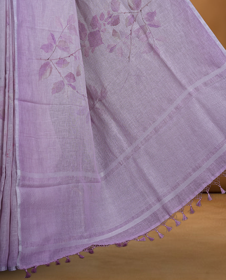 Lavender colour pure linen saree featuring leaf print pattern across body, silver thin border finished with matching blouse.