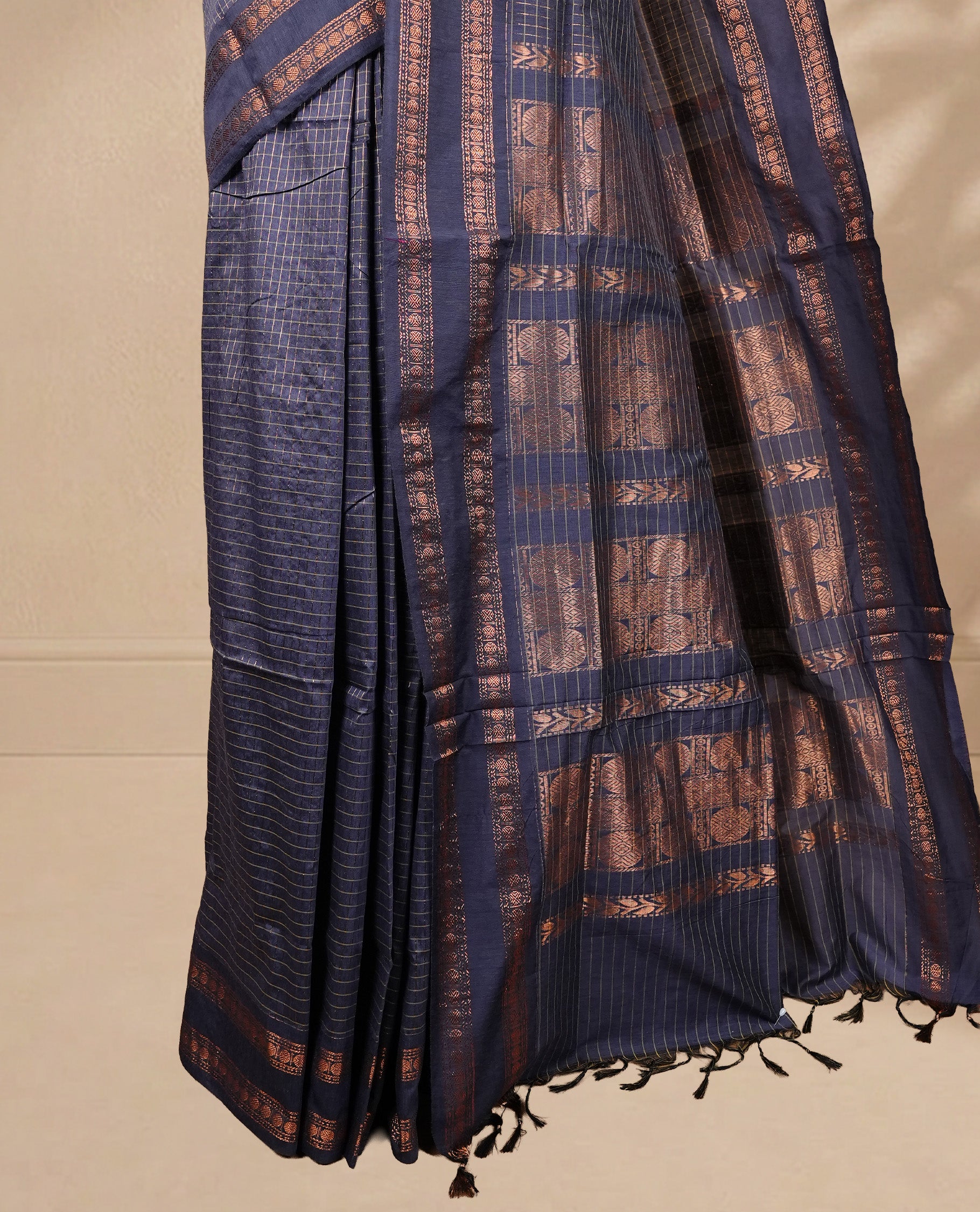 Grey colour kalyani cotton saree featuring gold zari check pattern on body, complemented by self colour with Antique zari border, paired with matching blouse piece.