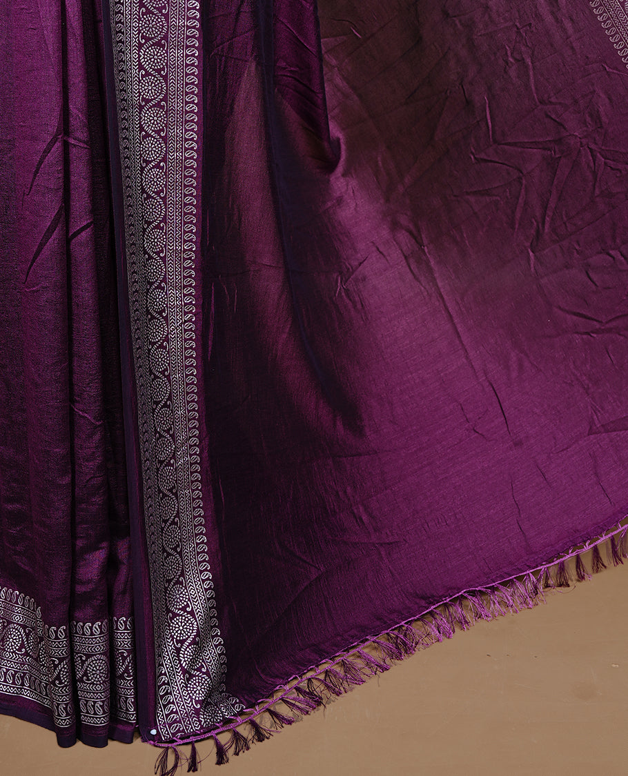 Purple colour semi silk saree featuring Elegant plain body with fancy border, comes with matching self colour blouse piece.