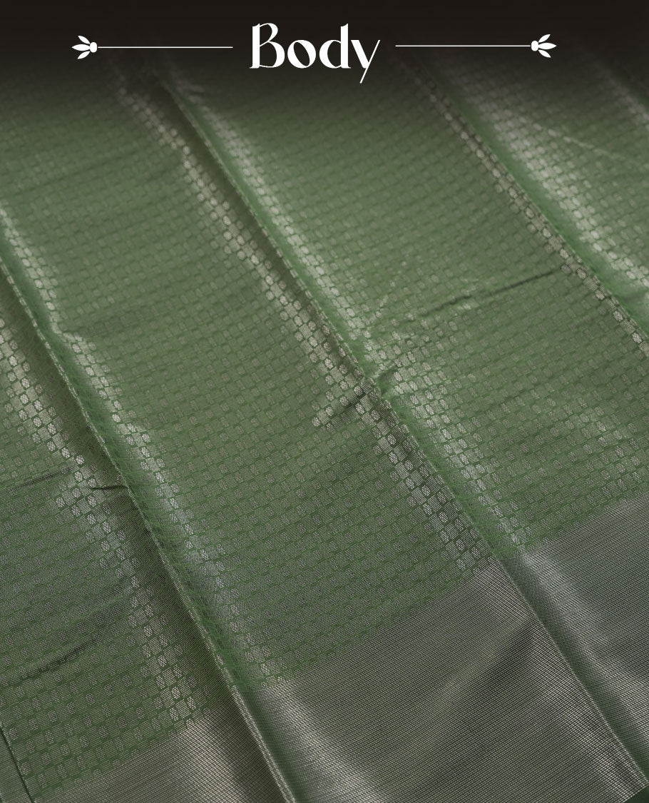 Dark green colour semi silk saree featuring neem zari Brocade Pattern all over the body, complemented by a Self Colour woven border with detailing, Pallu & blouse.