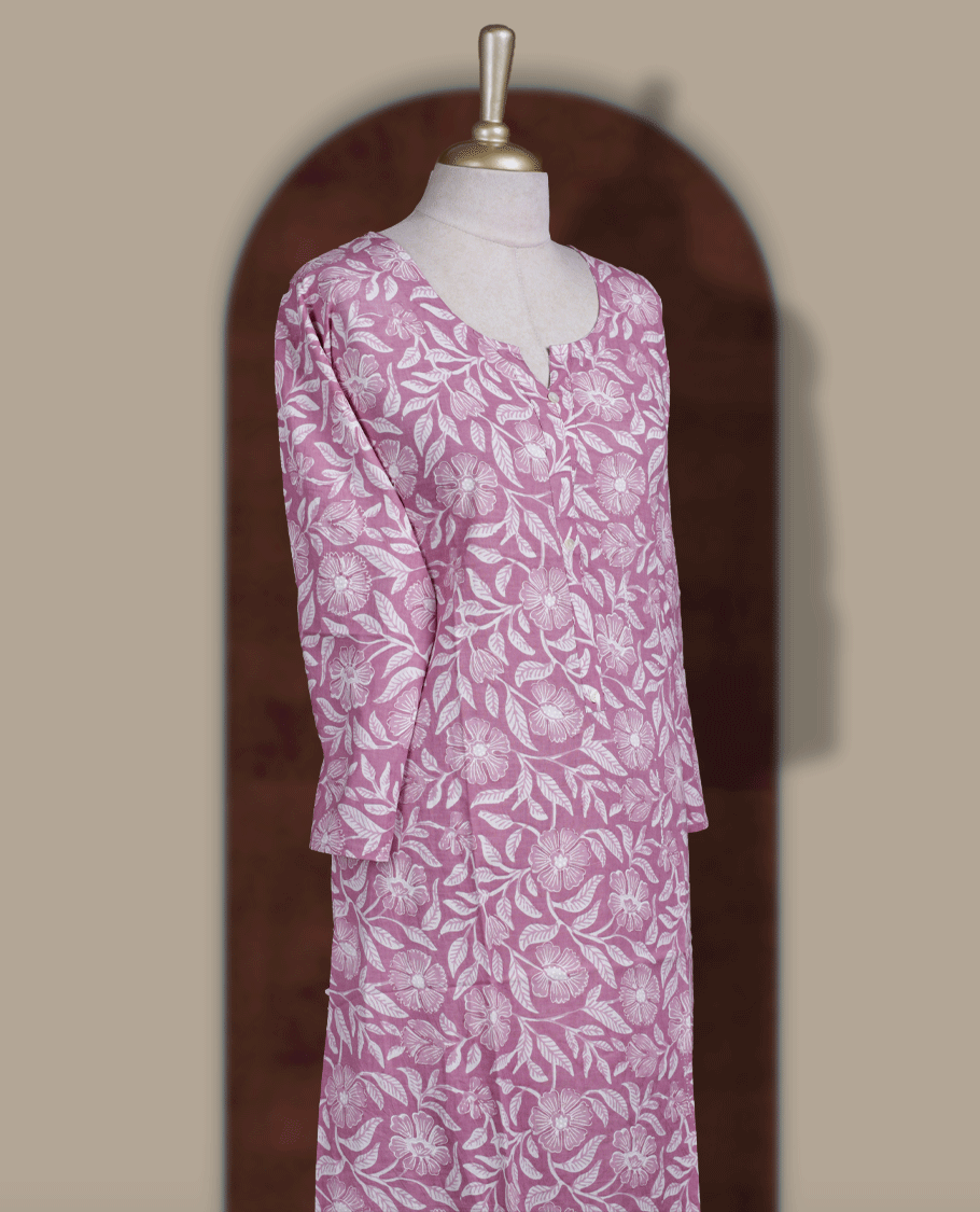 Mauve colour kurthi adorned with delicate white floral prints & styled with a round V notch neckline and comfortable 3/4th sleeves.
