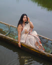 Golden Cream colour Tissue Saree featuring Kathakali printed with contrast Bronze border, Comes with Contrast Self Printed Blouse.