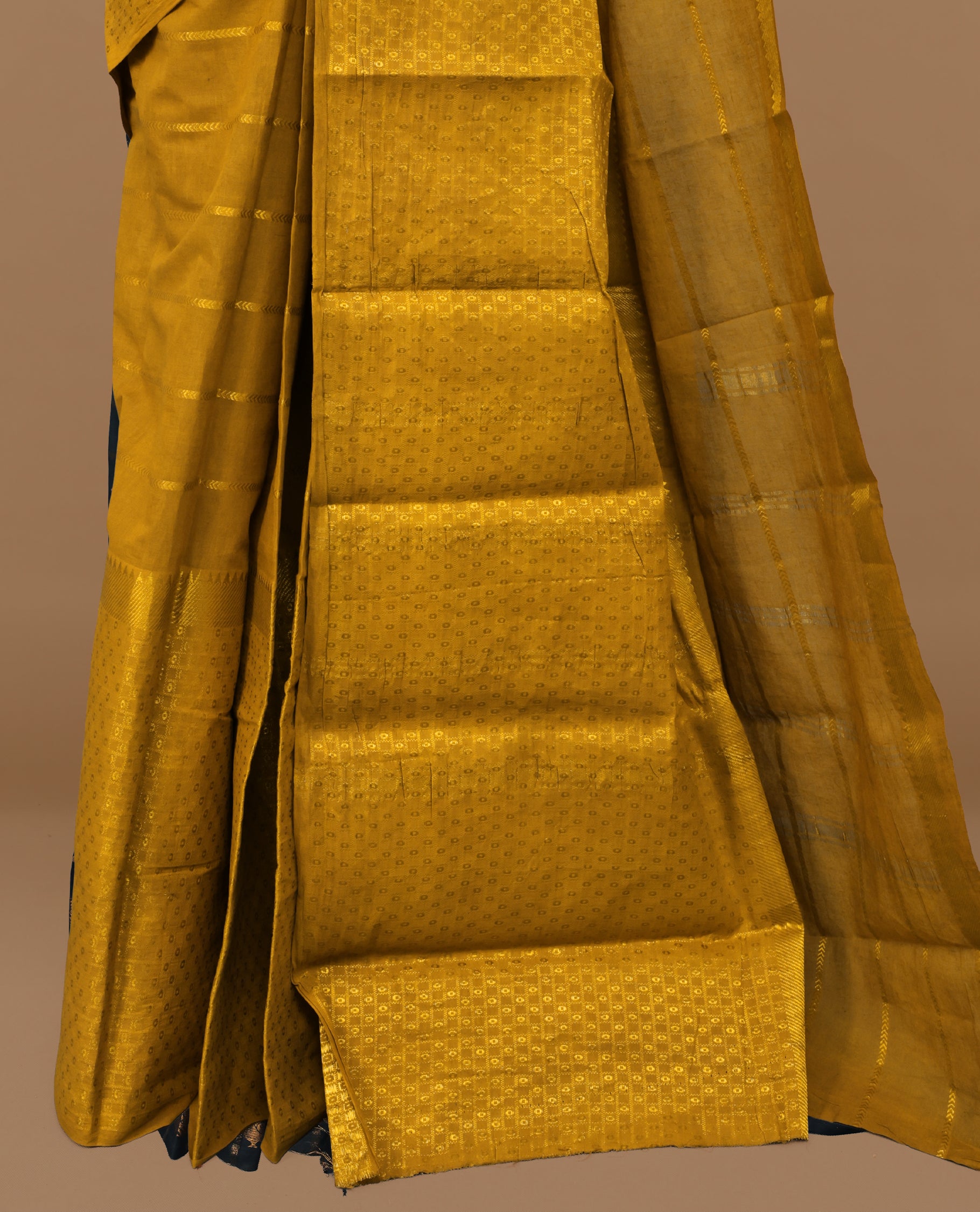 Mustard colour Sungudi cotton saree featuring Gold zari Stripes on body, Gold Small check zari on Self colour border, paired with matching blouse piece.