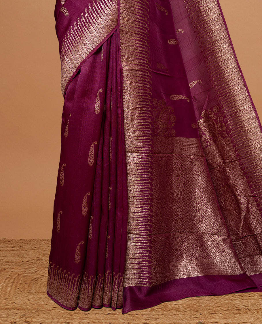 Deep Mauve colour Semi Banaras Tussar Georgette Featuring Gold zari Leaf pattern on body, Finished with Gold zari border and paired with matching blouse piece.