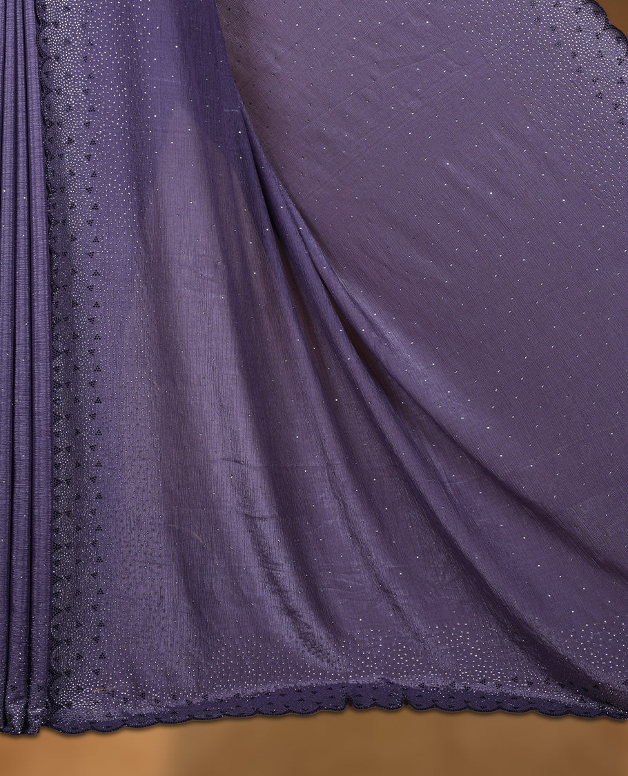 Dark pastel purple colour chiffon designer saree, featuring black and white scattered stone on body, stone work and heavy stone pattern on border and  pallu, Paired with matching blouse.