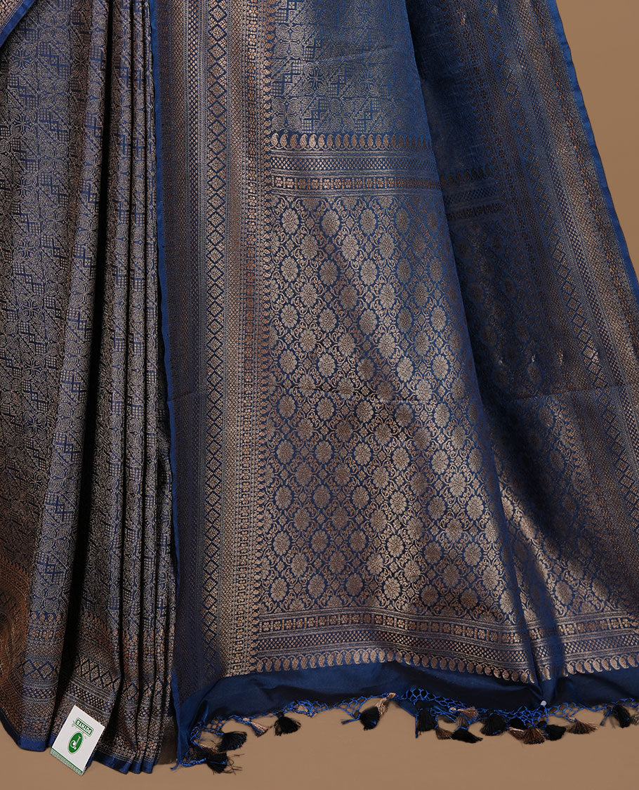 Teal colour semi banaras katan saree featuring Gold zari Pattern across body, complemented by self colour with zari border, paired with matching blouse piece.