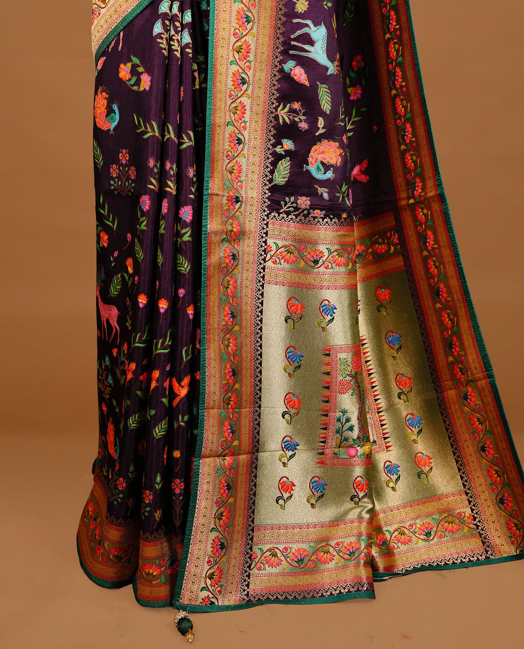 Deep Purple colour Pashmina Saree featuring a floral printed body, a multicolour floral woven border, a rich woven pallu with floral motifs, paired with a matching blouse.