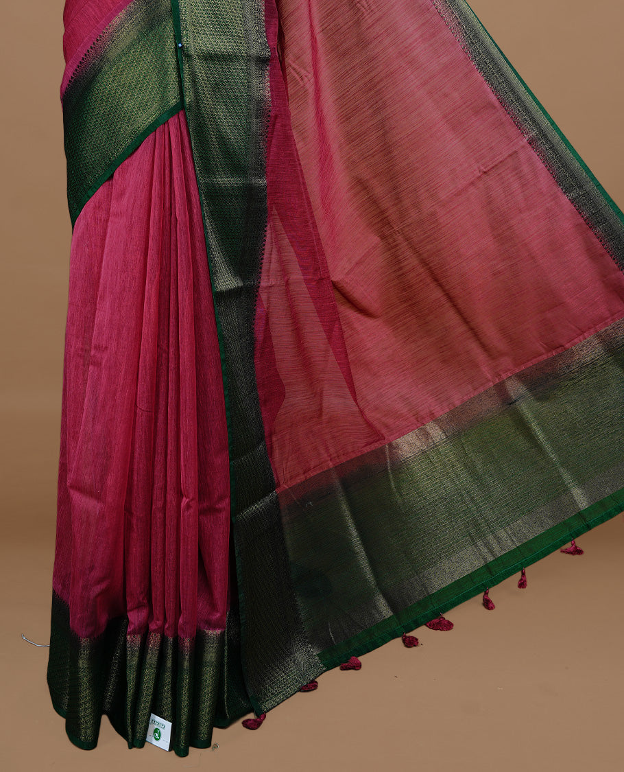 Mauve colour Semi linen saree featuring Elegant plain body, complemented by contrast Green colour With Antique zari border, paired with matching blouse piece.