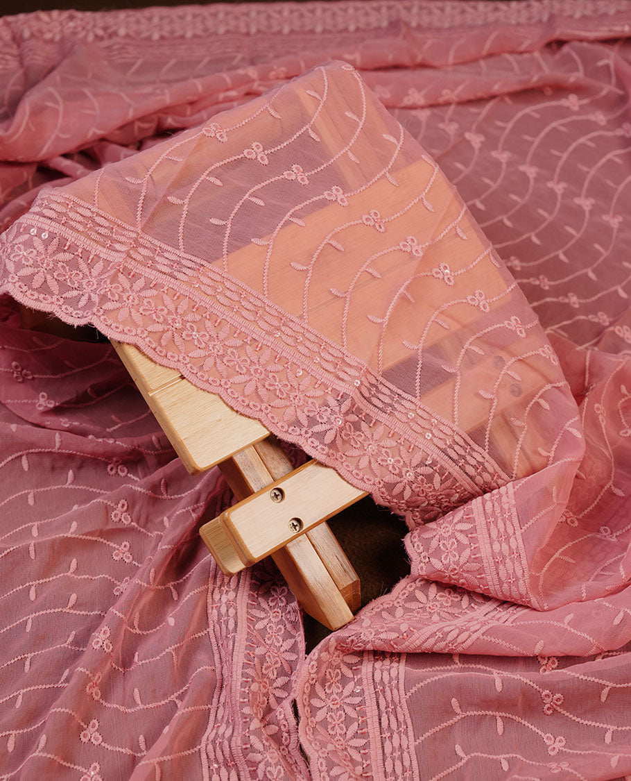 Peach colour churidhar Material featuring Intricate Thread Embroidery with Mirror and Cut Beads Work on the Front Panel, paired with an All Over Embroidered Net Dupatta and Matching Bottom
