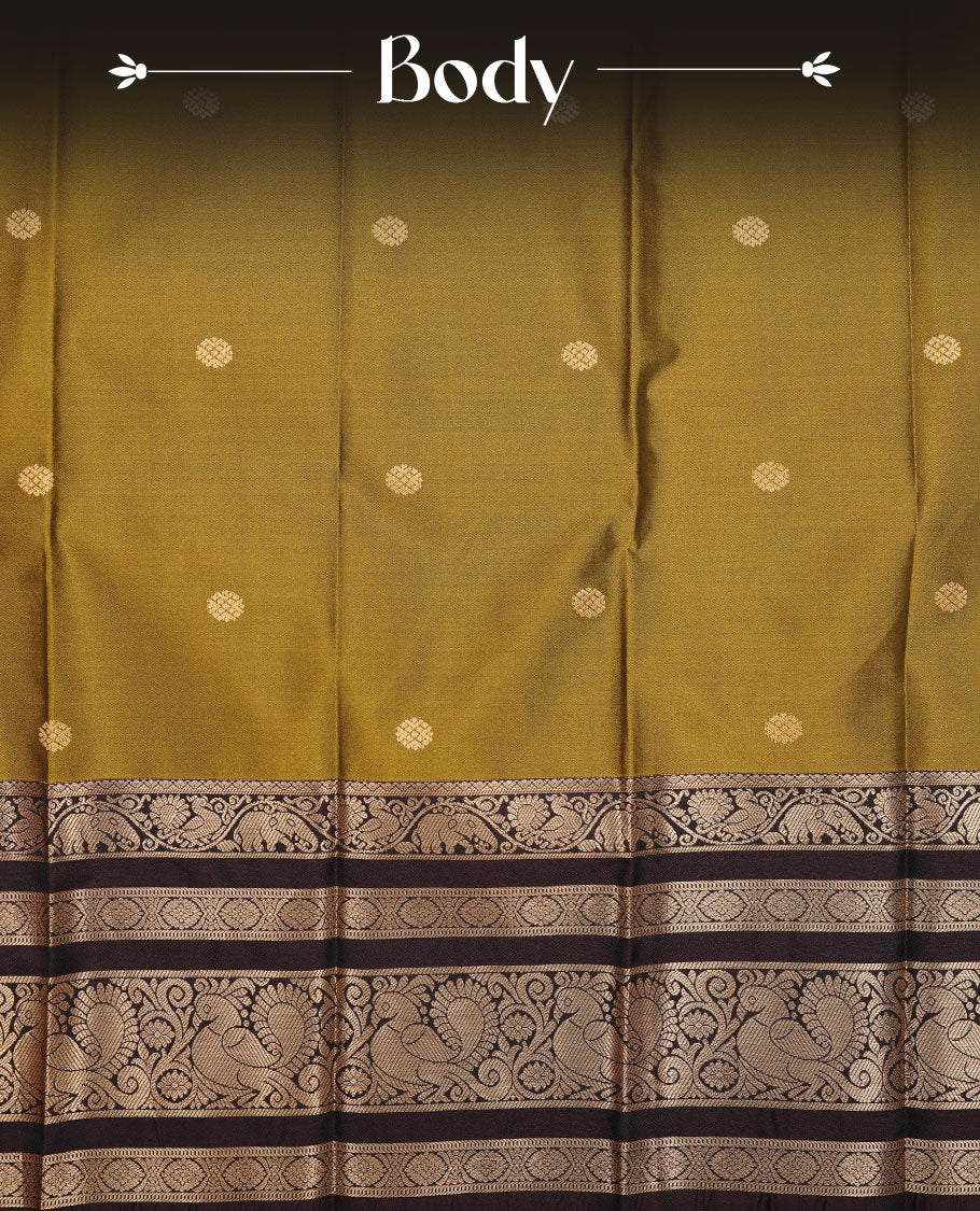 Olive colour soft silk saree featuring Gold zari motifs on body, complemented by contrast chocolate colour with traditional border, paired with matching blouse piece.