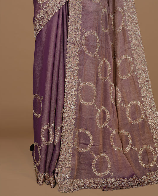 Purple colour organza saree featuring thread & gold stone pattern on body, highlighting scalp border, paired with Matching blouse piece.
