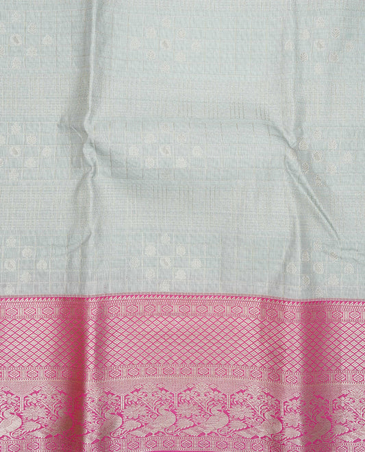 Silver grey colour semi wedding silk saree featuring silver zari checks with motifs on body,contrast magenta pink colour with peacock traditional border on body, rich pallu comes with matching blouse piece