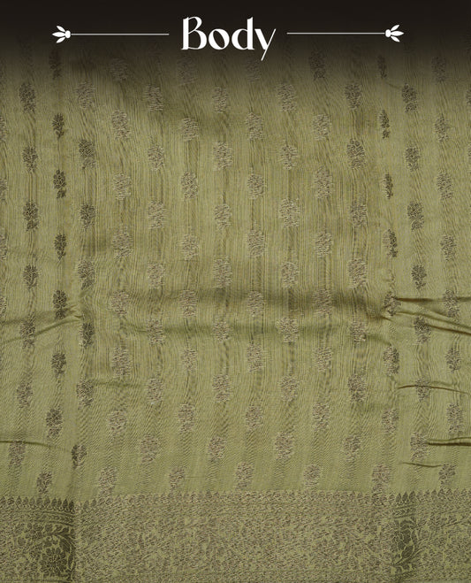 Olive colour semi tussar silk saree featuring elegant Antique zari motifs across the body, designed with a subtle borderless zari finish for a sophisticated traditional look. Paired with a matching blouse piece.