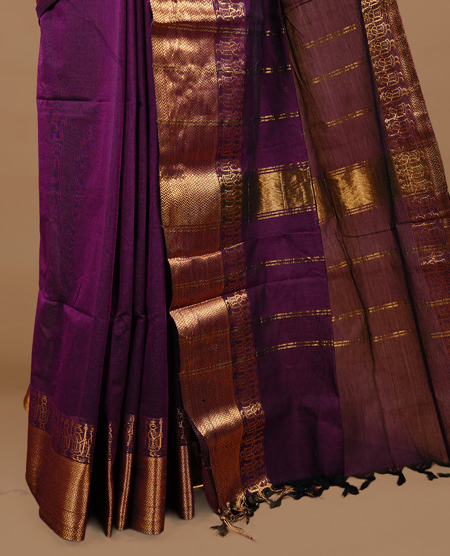 Deep purple colour chettinad cotton saree featuring elegant plain body, complemented by self colour with zari border, paired with matching blouse piece.