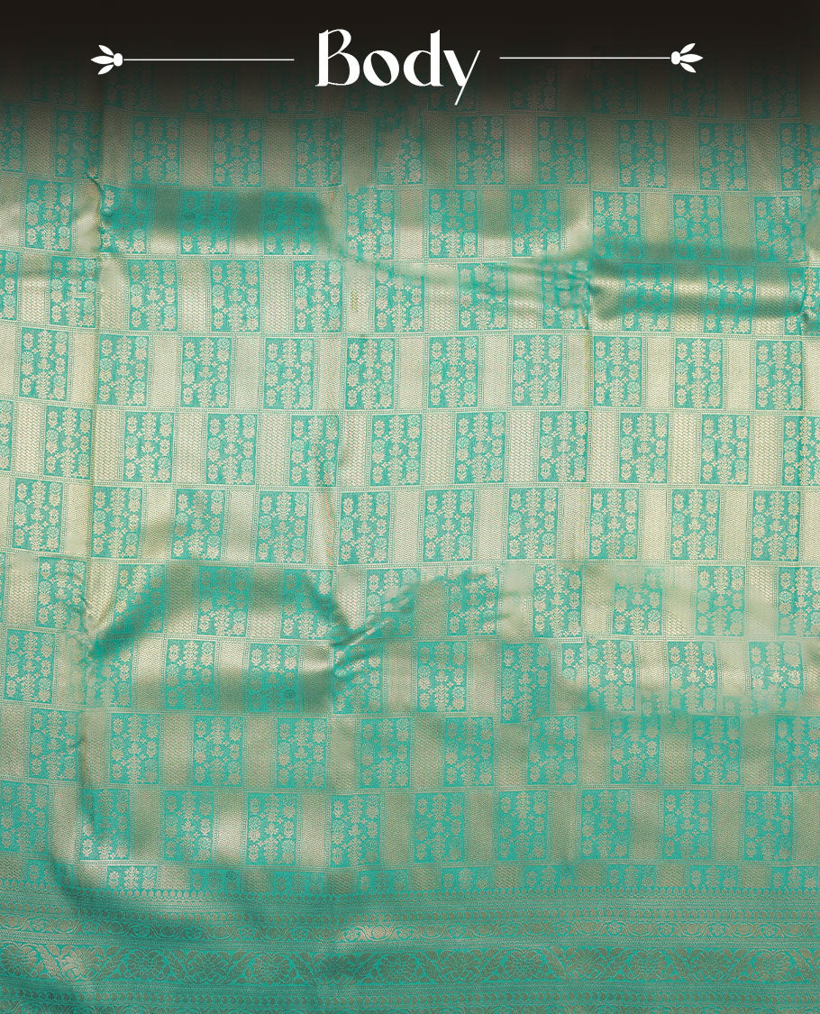 Aqua Blue colour semi silk brocade saree featuring intricate Gold Square patterns across the body, complemented by a Self colour woven border and pallu, paired with a matching blouse.