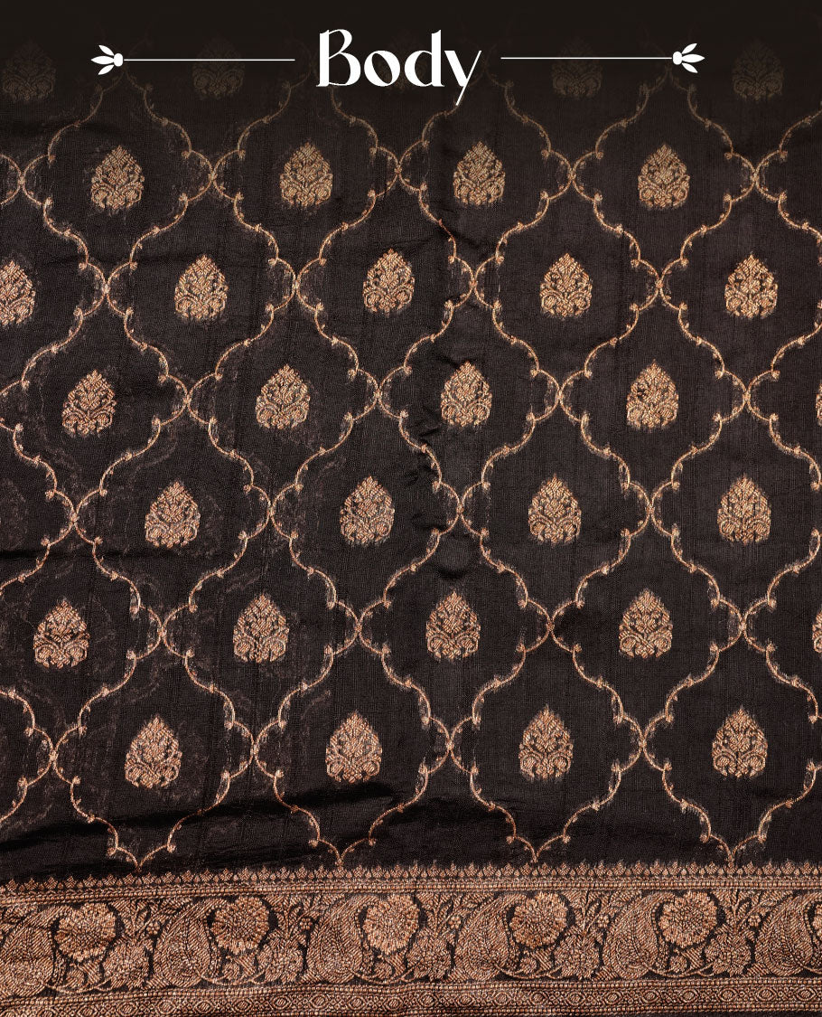 Black colour semi Banaras saree with gold zari buta motifs, finished with a traditional gold zari border and pallu, paired with a matching blouse.