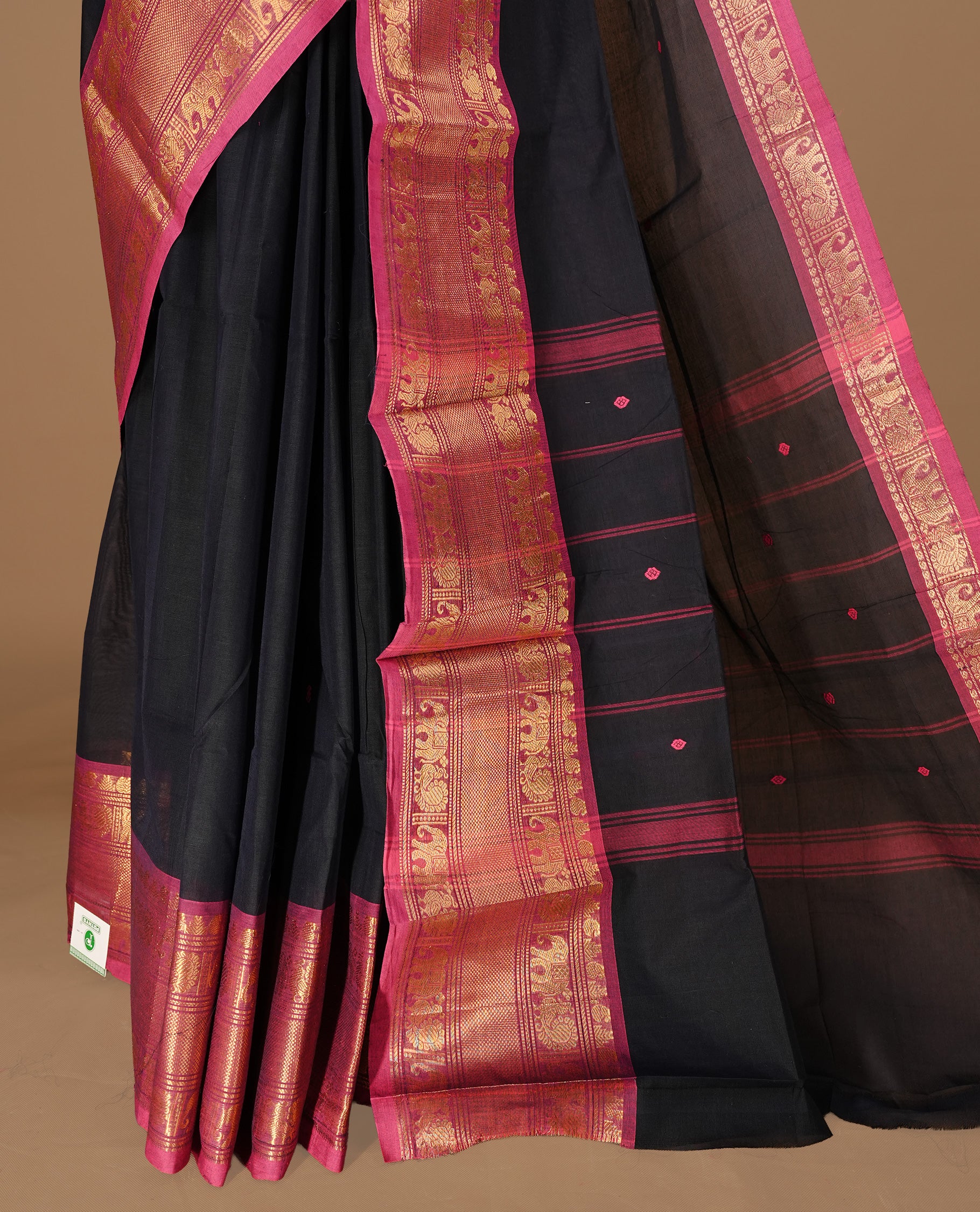Black colour Chettinad cotton saree featuring motifs on body , complemented by contrast Magenta colour with zari border, comes with matching blouse piece.