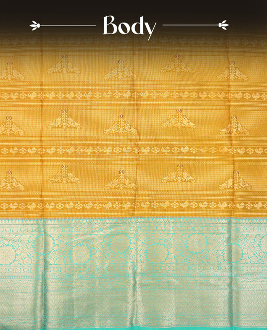 Mustard olive colour semi wedding saree featuring gold zari strip with motifs on body complemented by contrast aqua colour with traditional border, comes with macthing blouse piece.