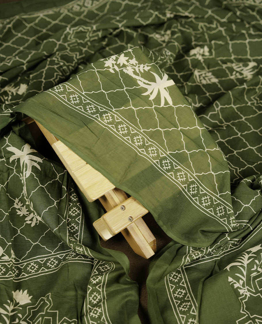 Dark green colour churidar set with stone and thread embroidery and detailing, paired with matching pant and dupatta.