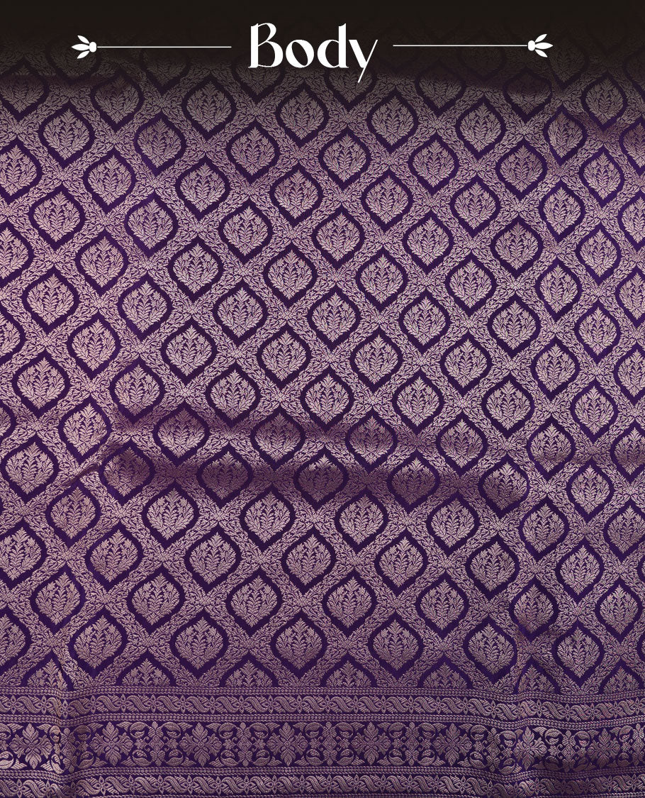 Deep purple colour banaras satin crepe saree featuring gold zari pattern across body, with self colour border with gold zari pattern and paired with matching blouse.