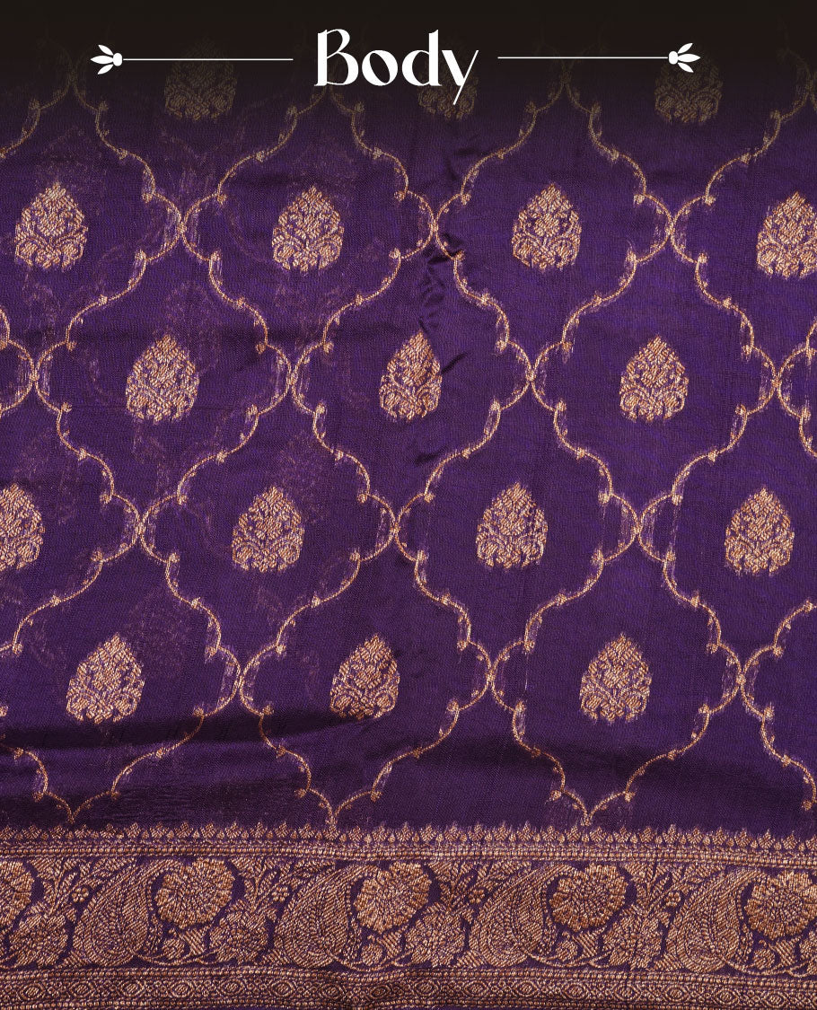 Purple colour semi Banaras saree with gold zari buta motifs, finished with a traditional gold zari border and pallu, paired with a matching blouse.