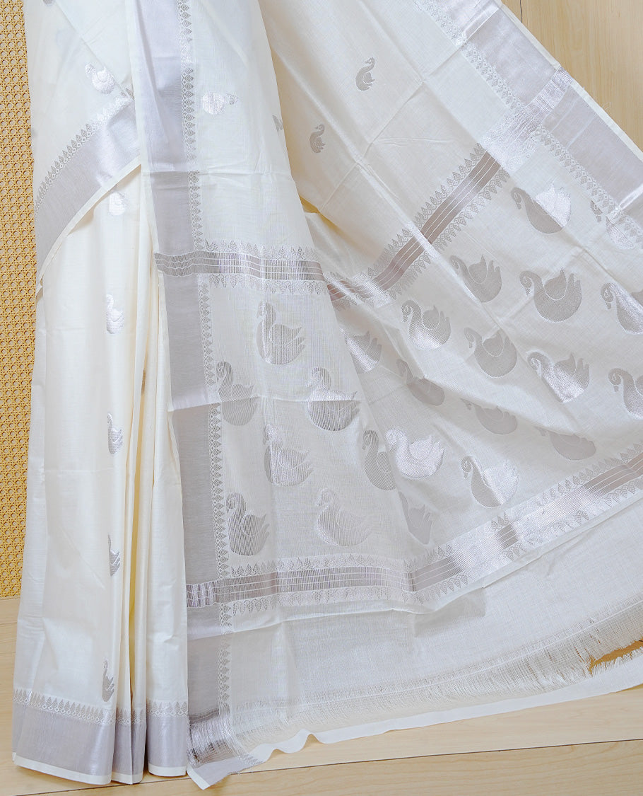 Cream Cotton Kerala Saree with Rose Gold Zari Duck Motifs, Rose Gold Zari Duck Pattern Border and  Pallu, Paired with a Matching Blouse Piece.