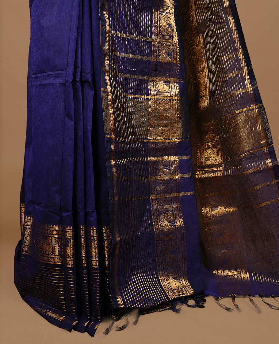Navy blue colour chettinad cotton saree featuring Elegant plain body, complemented by self colour with zari border, paired with matching blouse piece.