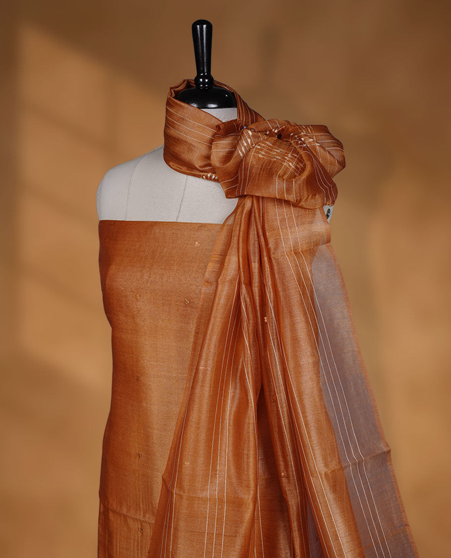 Mustard shade Tussar suit material with elegant thread detailing on the body, paired with a plain bottom and a worked Tussar dupatta.