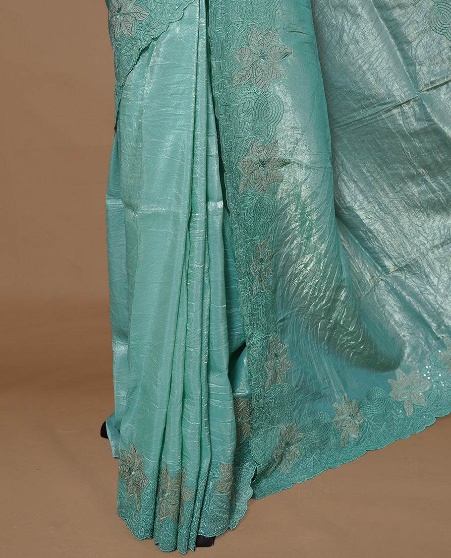 Pastel Green colour Crush Organza Featuring Plain body, Enrich with Floral thread pattern with sequins & scalp border, paired with matching blouse piece.