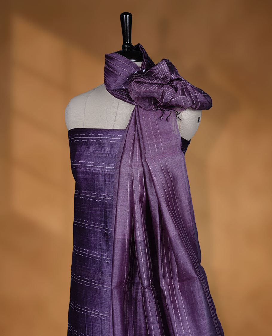 Dark Purple shade Tussar suit material with elegant thread detailing on the body, paired with a plain bottom and a worked Tussar dupatta.