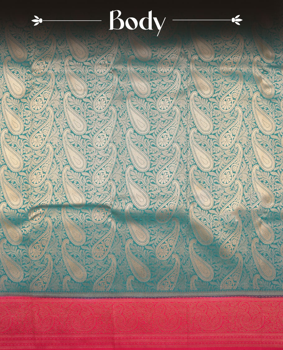 Blue colour semi silk brocade saree featuring intricate Gold Floral kodi & leaf patterns across the body, complemented by a contrast Magenta colour woven border and pallu, paired with a matching blouse.