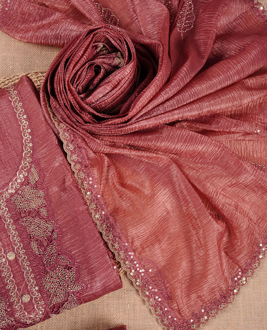 Mauve taupe colour churidar set with stone and thread embroidery and detailing, paired with matching pant and dupatta.