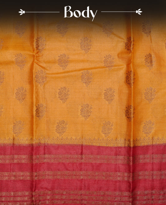 Mustard colour pure tussar banaras silk saree featuring gold zari motifs on body, highlighting contrast Maroon colour with zari border, paired with matching blouse piece.