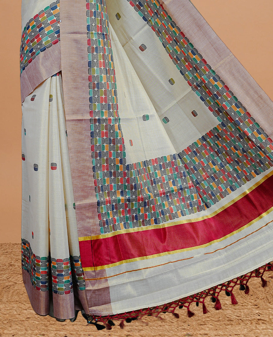 Cream Colour Tissue Kerala Saree Featuring Classy Multi Colour Box Pattern On Body, Styled By BrickRed & Gold Zari Border And Pallu, Comes With Matching Blouse Piece.