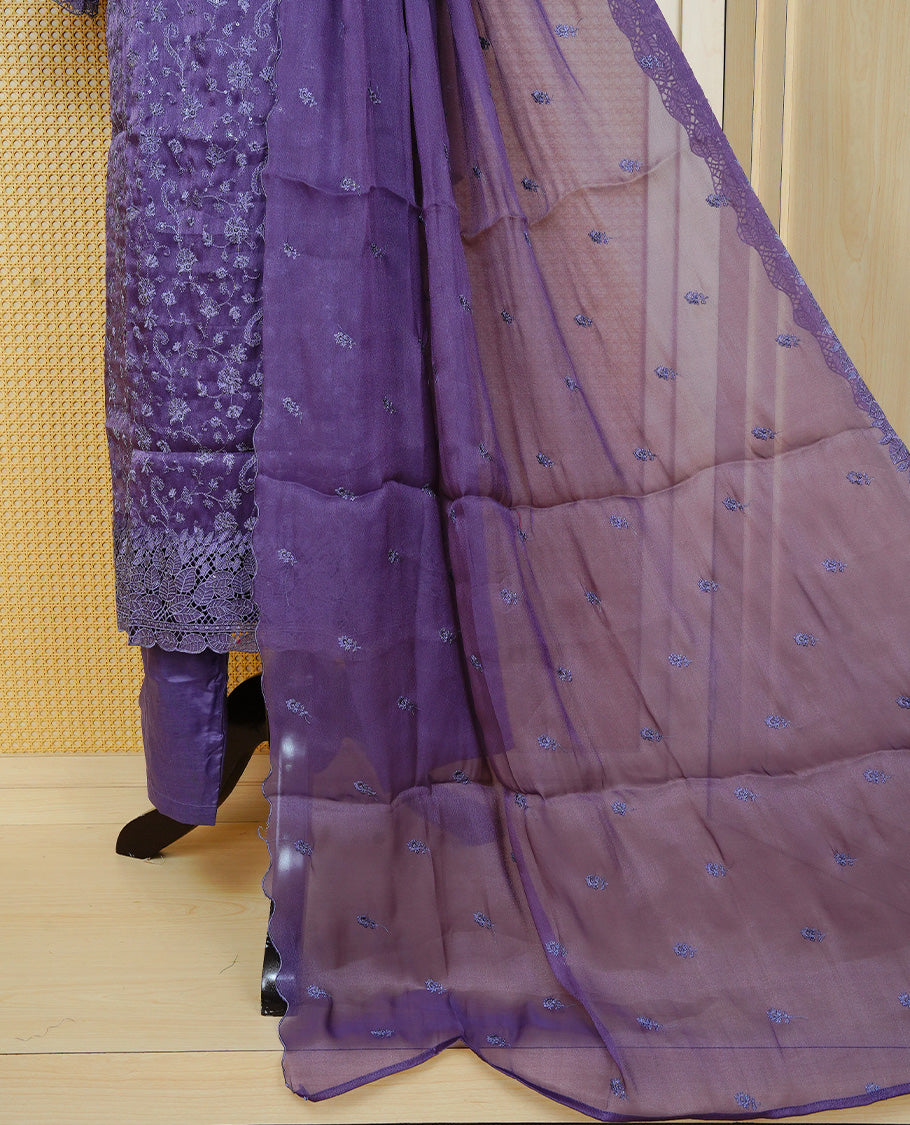 Greyish Purple colour churidar set with floral thread embroidery on body & V-neckline, paired with a matching embroidered dupatta and solid pants.