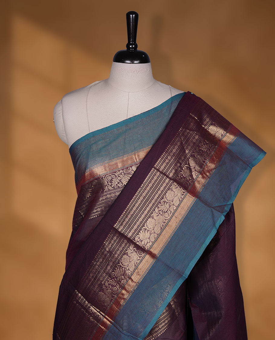 Wine colour chettinad cotton saree featuring plain body, with matching traditional gold zari border paired with matching blouse.